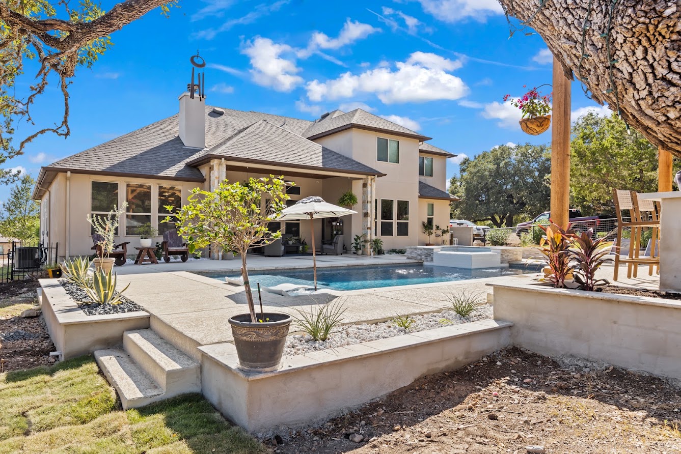 Custom gunite pool with raised spa in a Hill Country backyard in Anaqua Springs Ranchountry in Anaqua Springs Ranch, Boerne TX