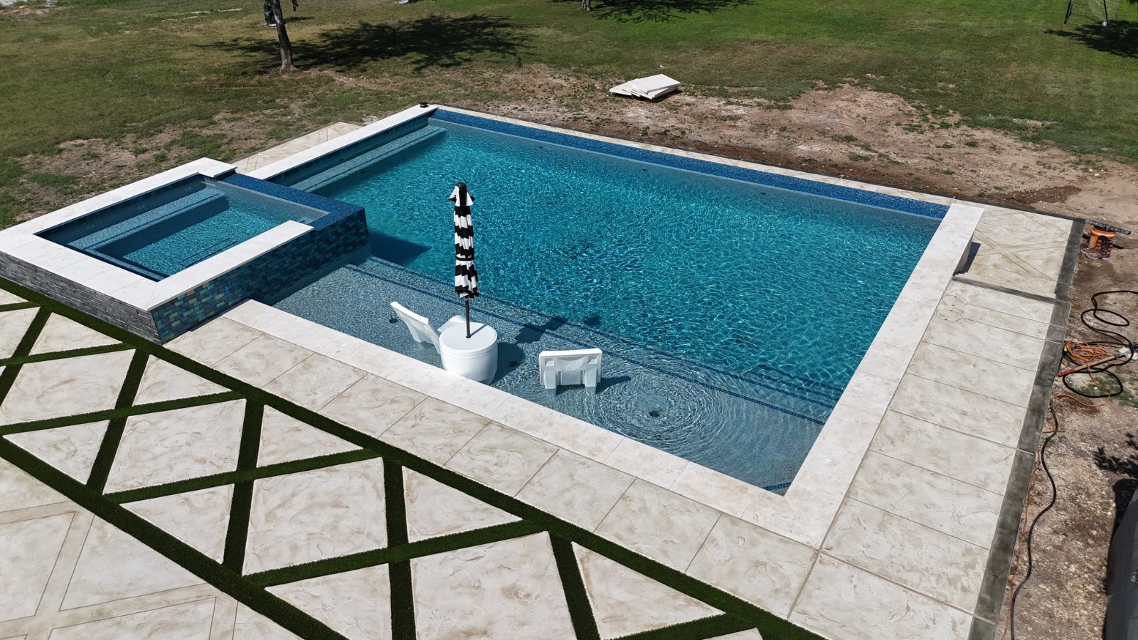 Custom waterfall swimming pool built by J. Oliver Pools in Rim Rock Ranch, Bulverde, Texas